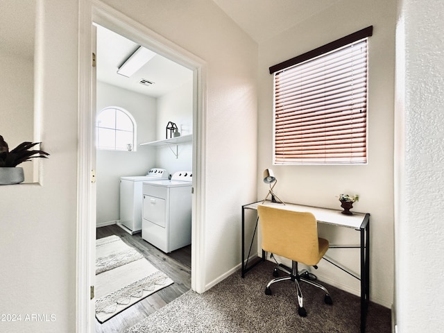 washroom featuring hardwood / wood-style flooring and washing machine and clothes dryer