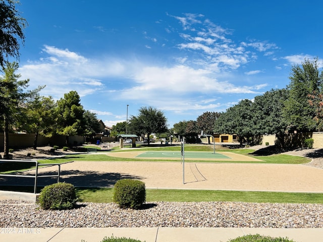 view of community with volleyball court and basketball hoop