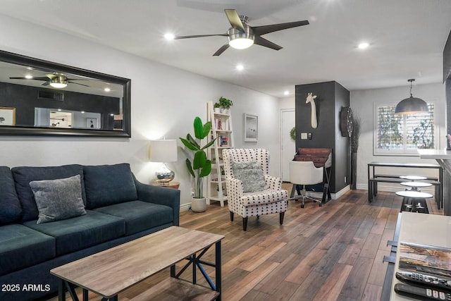 7625 E Camelback Rd Unit 310B, Scottsdale, AZ 85251 - living room with ceiling fan, baseboards, wood finished floors, and recessed lighting