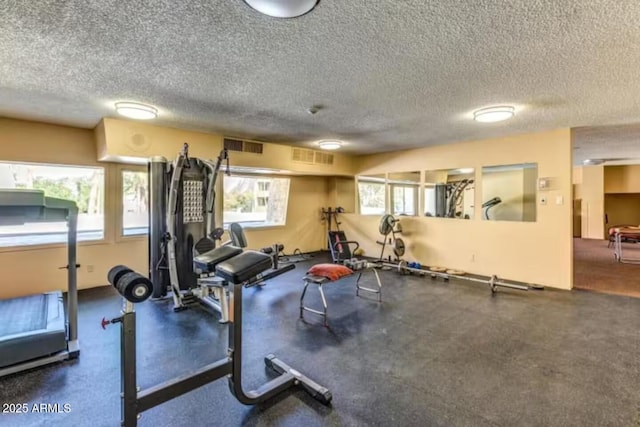 7625 E Camelback Rd Unit 310B, Scottsdale, AZ 85251 - workout area with a textured ceiling