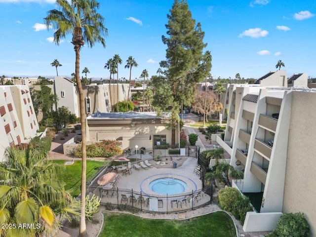 7625 E Camelback Rd Unit 310B, Scottsdale, AZ 85251 - view of swimming pool featuring fence, a patio, and a community hot tub