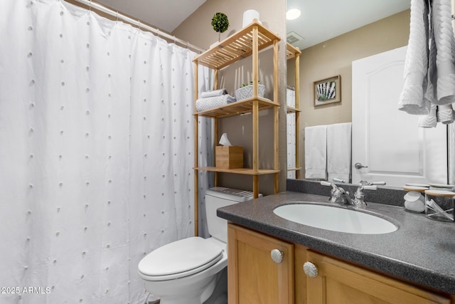 bathroom featuring toilet, a shower with curtain, and vanity