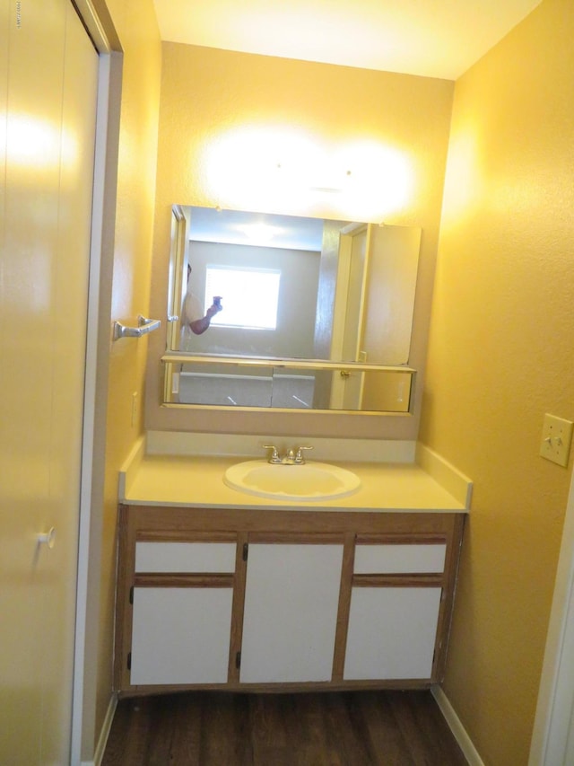 bathroom featuring vanity and wood-type flooring