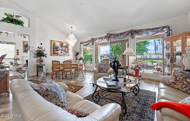 living room with lofted ceiling and a chandelier