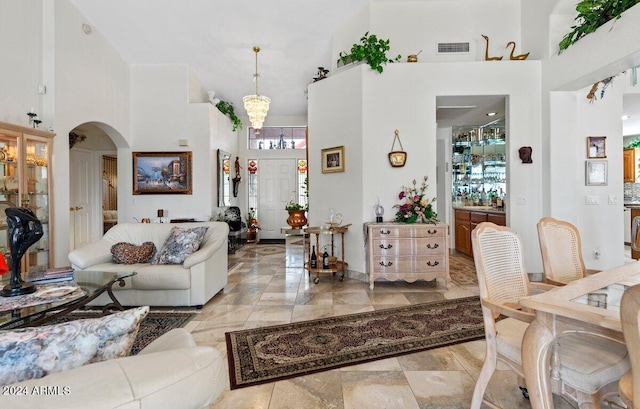 living room featuring a high ceiling