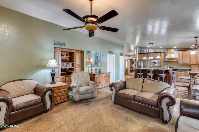 living room featuring ceiling fan and light colored carpet