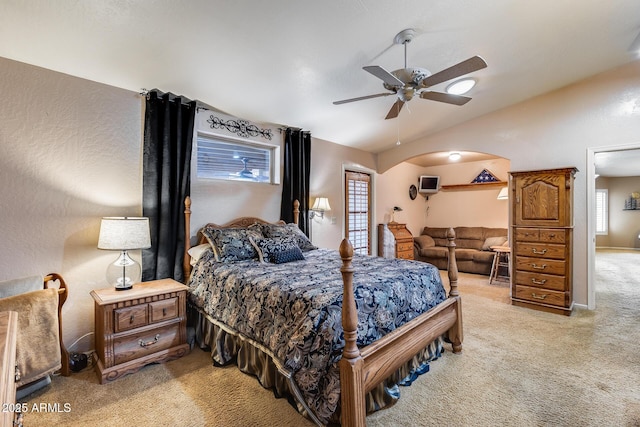 carpeted bedroom featuring vaulted ceiling and ceiling fan