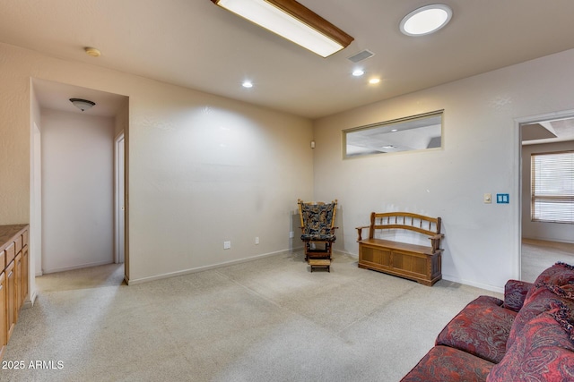 living area with light colored carpet