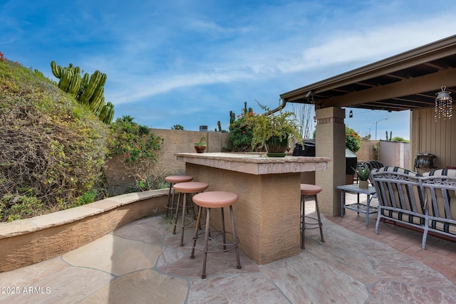 view of patio / terrace featuring exterior bar