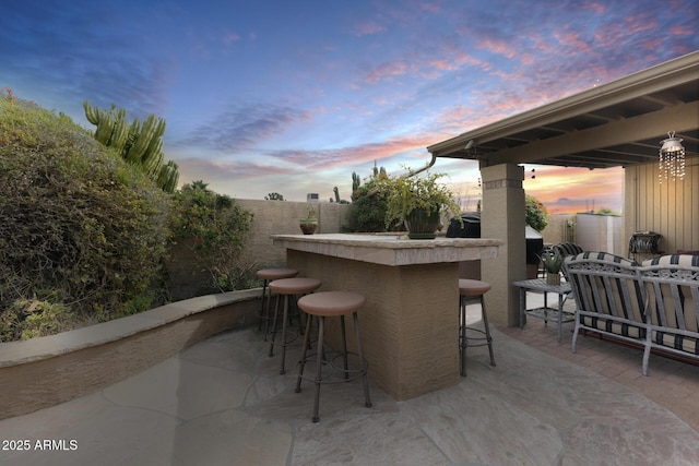 patio terrace at dusk with exterior bar