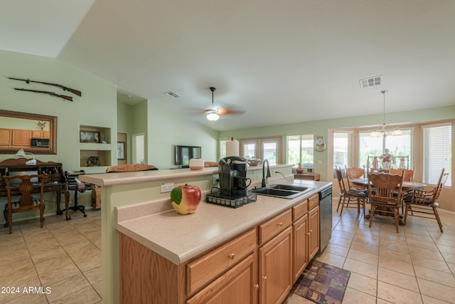 kitchen with lofted ceiling, sink, dishwasher, an island with sink, and pendant lighting