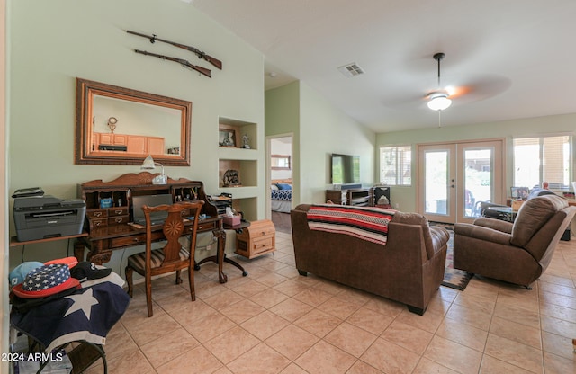 tiled living room featuring vaulted ceiling, built in features, ceiling fan, and french doors