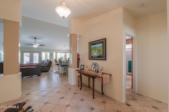 hall featuring light tile patterned floors