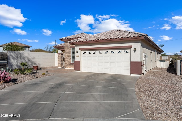 view of front facade featuring fence, driveway, an attached garage, stucco siding, and a tile roof