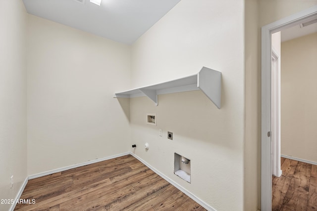 washroom with laundry area, hookup for a washing machine, gas dryer hookup, and wood finished floors