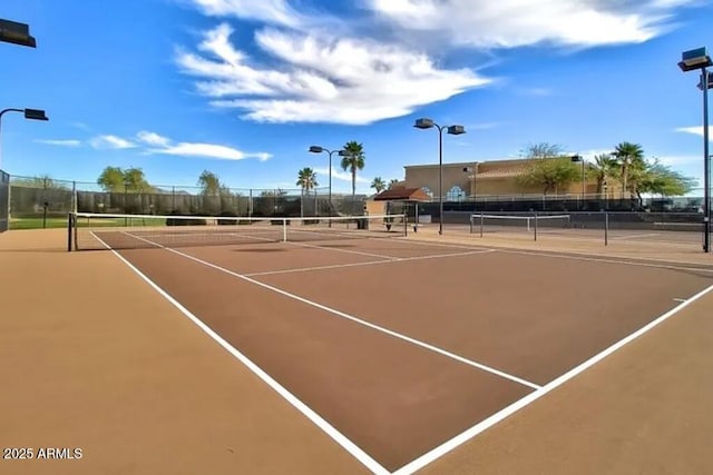 view of sport court featuring community basketball court and fence