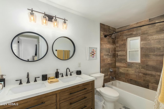 full bathroom with vanity, tiled shower / bath combo, and toilet