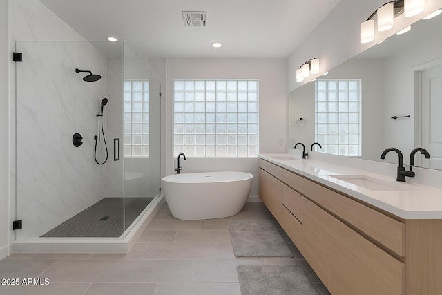 3707 N 188th Ave, Litchfield Park, AZ 85340 - full bath featuring a shower stall, a soaking tub, double vanity, tile patterned floors, and recessed lighting
