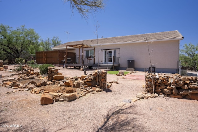 rear view of property with a patio and central air condition unit