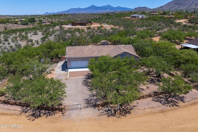 birds eye view of property with a mountain view