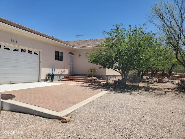 single story home featuring a garage