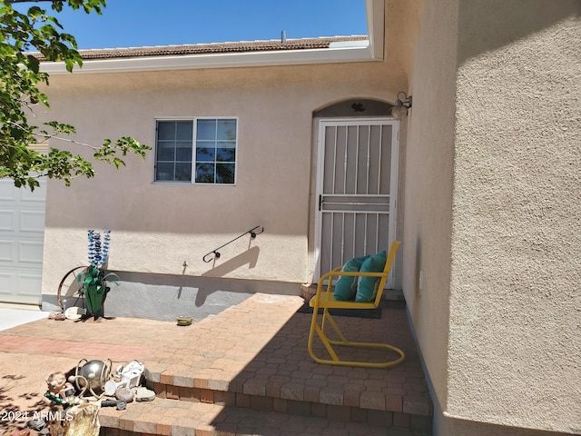 property entrance with a garage