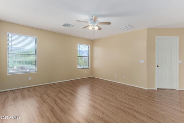 unfurnished room featuring light hardwood / wood-style flooring and ceiling fan