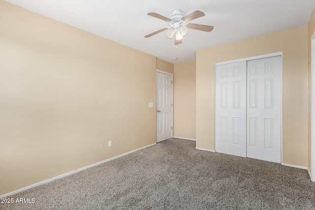 unfurnished bedroom with carpet floors, ceiling fan, and a closet