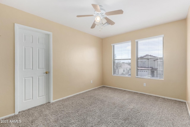 empty room featuring carpet and ceiling fan