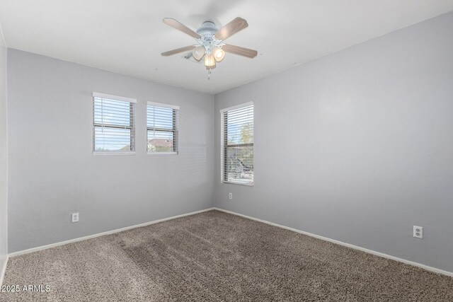 carpeted empty room with ceiling fan