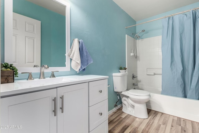 full bathroom with vanity, hardwood / wood-style flooring, toilet, and shower / bath combo with shower curtain