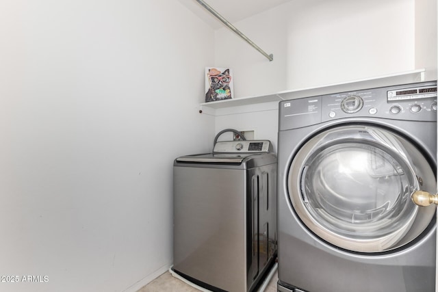 laundry room with separate washer and dryer