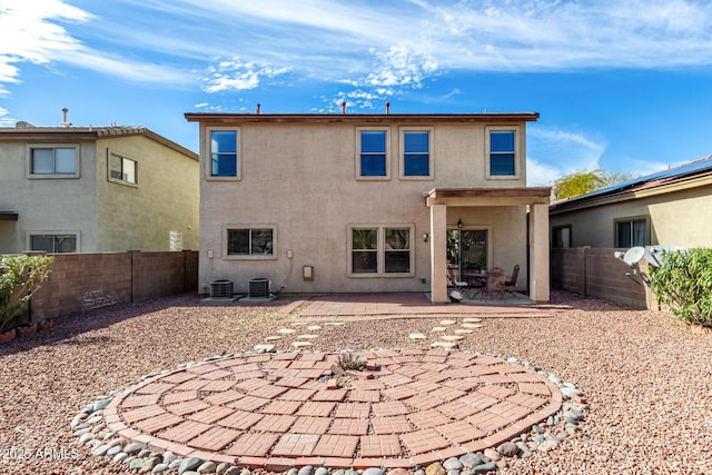 back of house with a patio