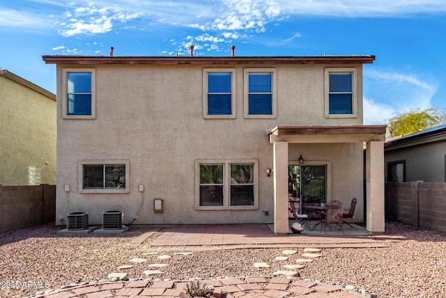 rear view of house featuring a patio and central air condition unit