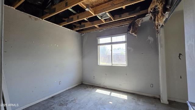 interior space featuring baseboards
