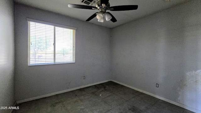 empty room with ceiling fan, baseboards, visible vents, and tile patterned flooring