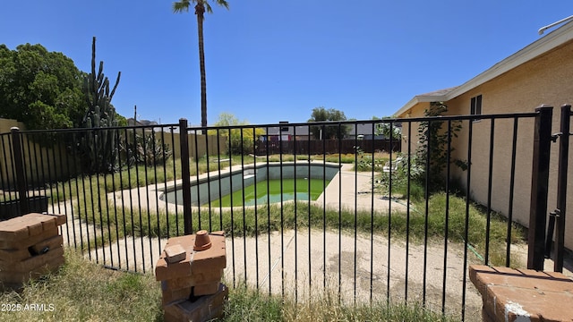 view of gate with fence