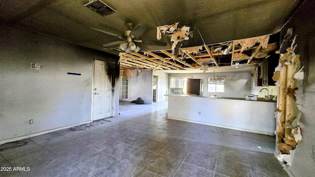 kitchen featuring tile patterned flooring, visible vents, open floor plan, and ceiling fan
