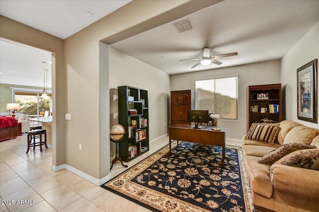 office with ceiling fan and light tile patterned floors