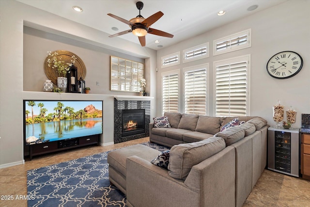 9262 E Desert Park Dr, Scottsdale, AZ 85255 - living room with beverage cooler, ceiling fan, a fireplace, and recessed lighting