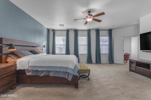 carpeted bedroom with ceiling fan