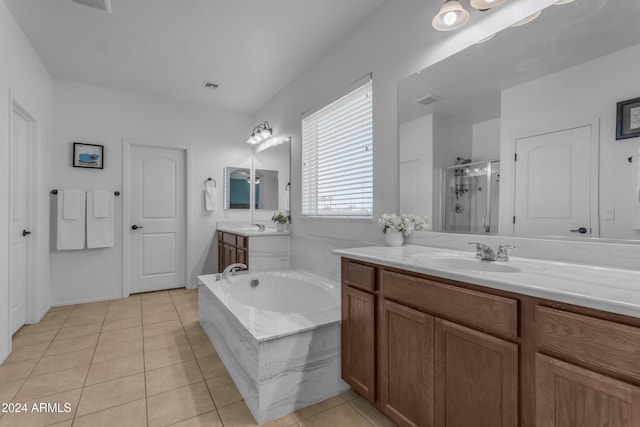 bathroom featuring tile patterned flooring, vanity, and separate shower and tub