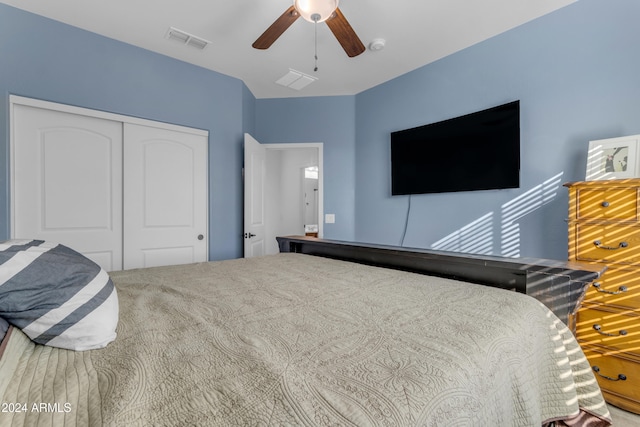 bedroom featuring carpet, a closet, and ceiling fan