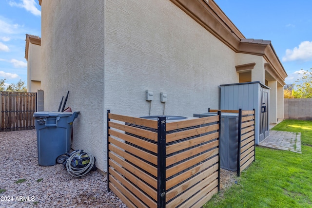 view of side of property featuring central air condition unit