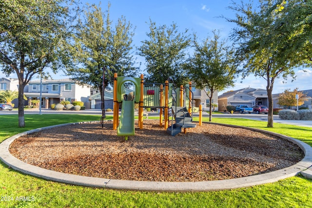 view of playground with a lawn