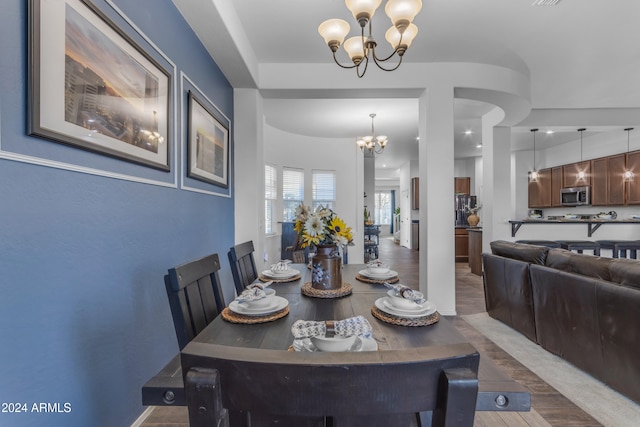 dining room featuring a chandelier and hardwood / wood-style floors