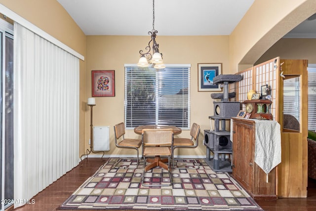 sitting room featuring dark hardwood / wood-style floors and an inviting chandelier