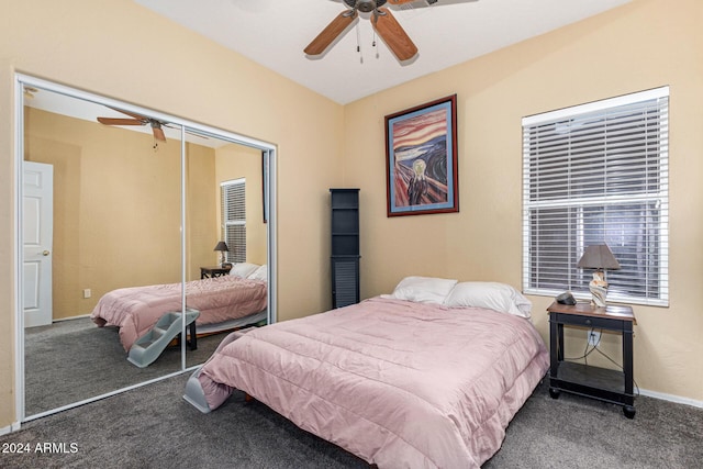 carpeted bedroom with ceiling fan and a closet