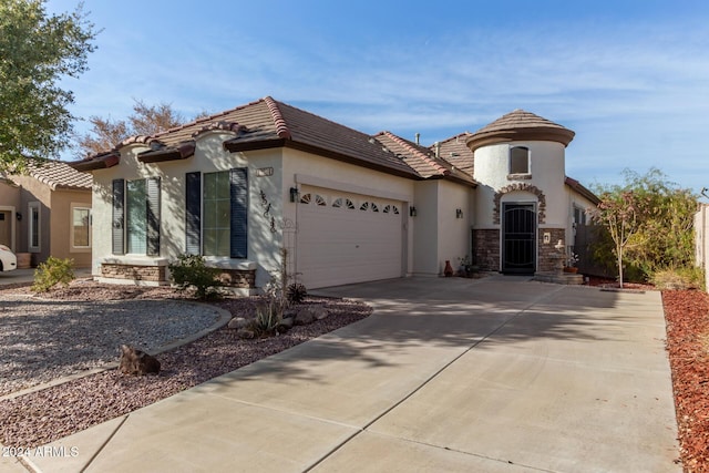 mediterranean / spanish-style house featuring a garage