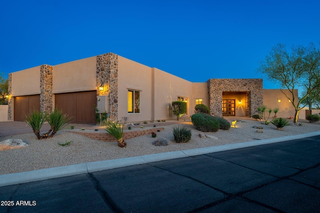 37015 N 27th Pl, Cave Creek, AZ 85331 - southwest-style home with a garage, stone siding, driveway, and stucco siding